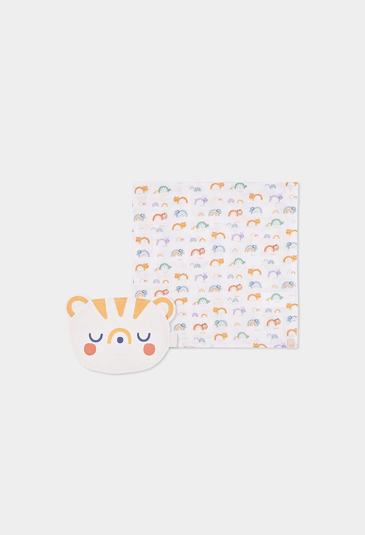 A baby gift set featuring a white square cloth with a repeating pattern of small multicolored rainbows and animals, alongside a matching white silicone bib clip shaped like a smiling tiger face.